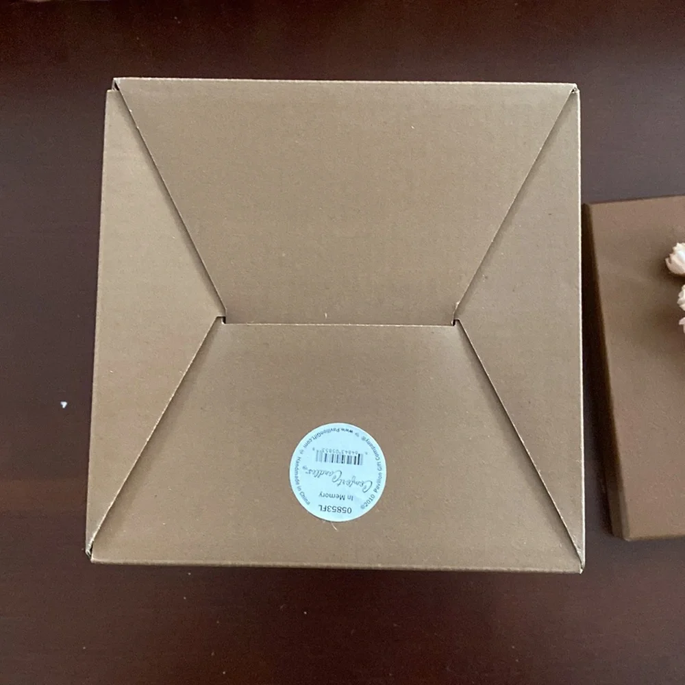 Pretty storage/gift box. Cardboard. Bronzish color with orange ribbon and flower